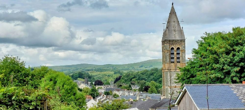 A view across Tavistock, past The Catholic Church of Our Lady of the Assumption towards Dartmoor